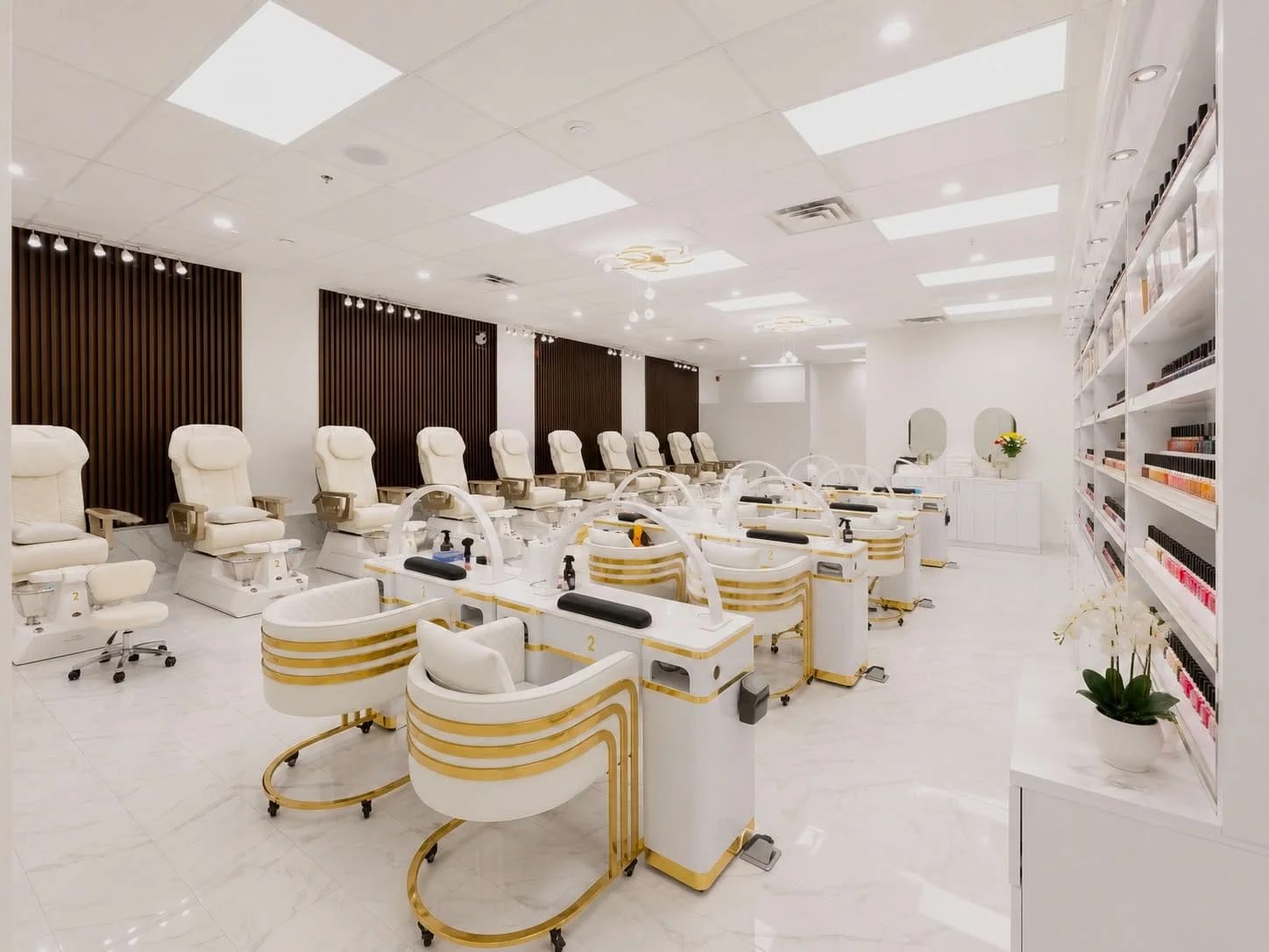 Rows of pedicure chairs and manicure stations at Doris Nails Lounge